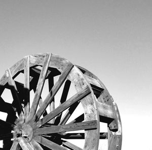 Low angle view of wheel against clear sky