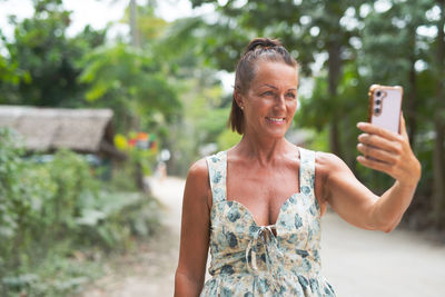 Young woman using mobile phone