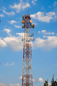 Low angle view of electricity pylon against sky