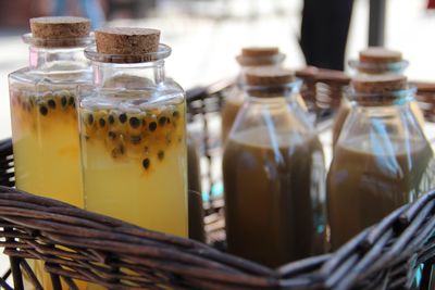 Close-up of bottles in wicker basket