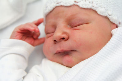 Close-up of baby boy sleeping at home