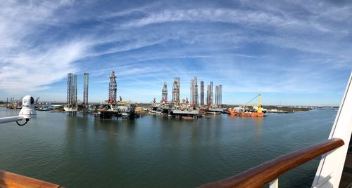 Fish-eye lens shot of commercial dock against sky