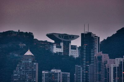 Buildings in city at dusk