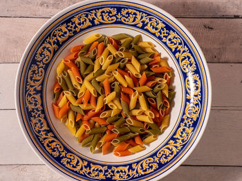 High angle view of chopped vegetables in bowl on table