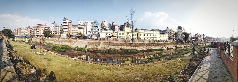 High angle view of buildings in town against sky