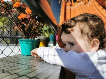 Portrait of boy looking at table