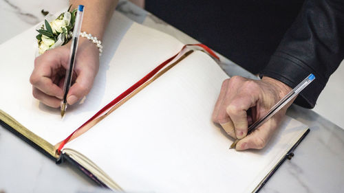 Close-up of man holding book