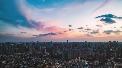 High angle view of city at sunset