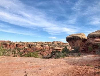 Landscape of two large boulders and valley of rock formations below