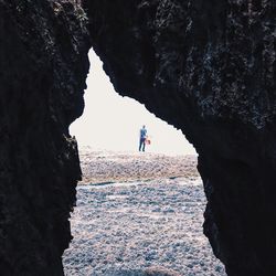 Rear view of man on rock formations