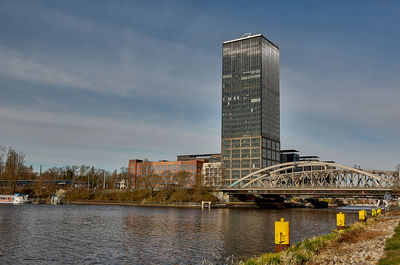 Bridge over river against sky during sunset