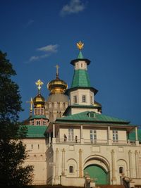 Low angle view of building against blue sky