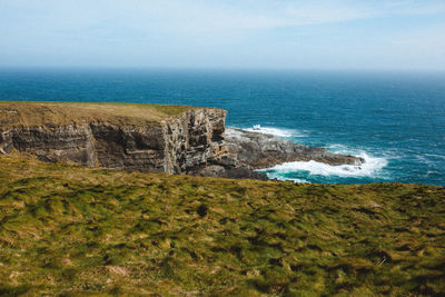 Cliffs and waves at mizen head peninsula ireland