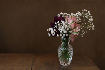 Close-up of flower vase on table