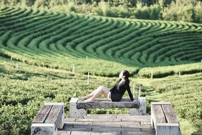 Woman sitting in farm