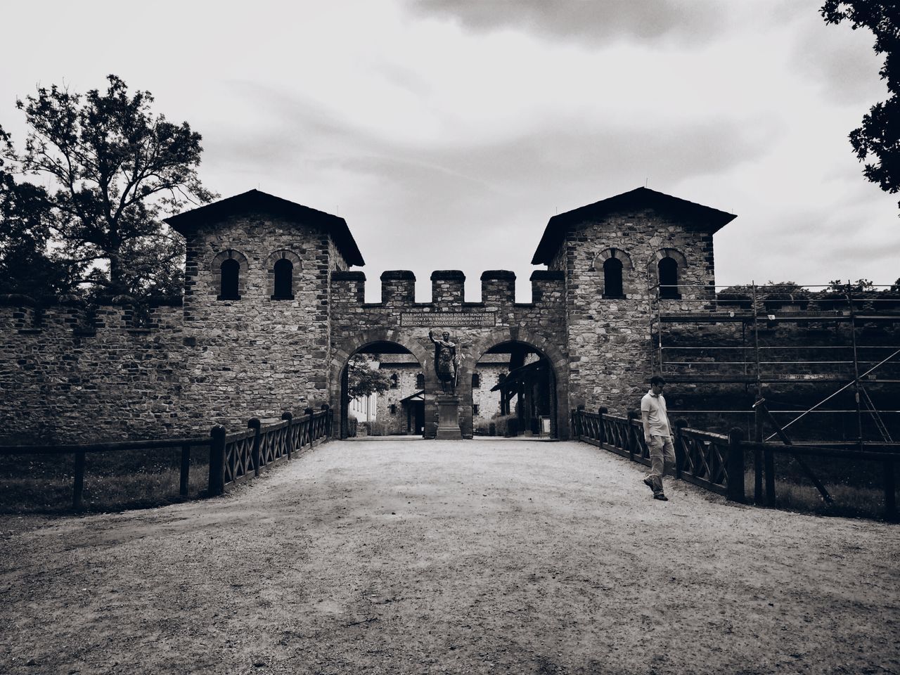 architecture, built structure, building exterior, sky, arch, cloud - sky, history, old, stone wall, the way forward, cloud, day, building, brick wall, outdoors, wall - building feature, the past, no people, tree, cloudy