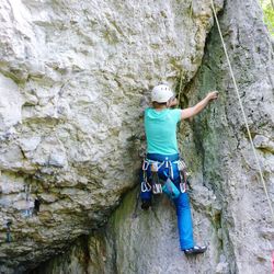 Full length of man climbing on rock