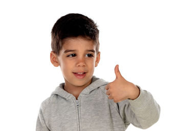 Portrait of smiling boy against white background