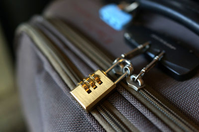 Close-up of padlock on suitcase