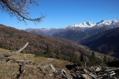 Scenic view of mountains against clear blue sky