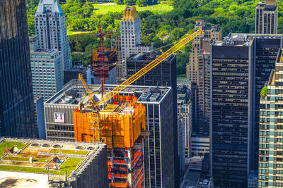 Construction site by modern buildings in city