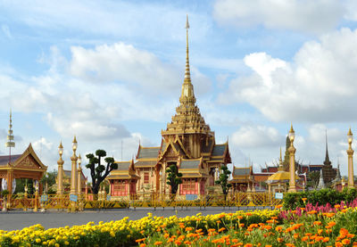 View of temple building against cloudy sky