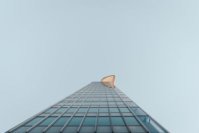 Low angle view of skyscraper against clear sky