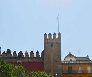 Low angle view of historical building against clear blue sky