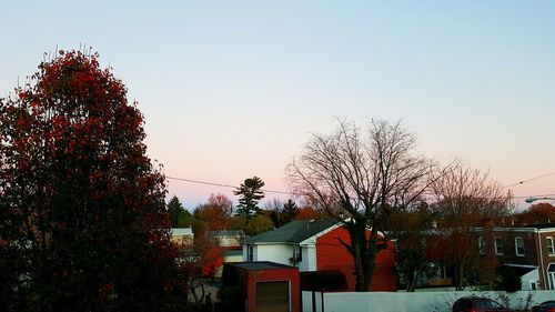 Low angle view of houses against clear sky