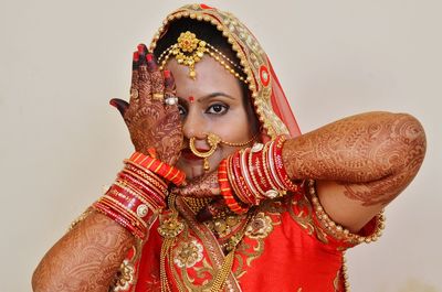 Close-up of bride against wall