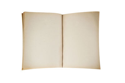 Close-up of open book against white background