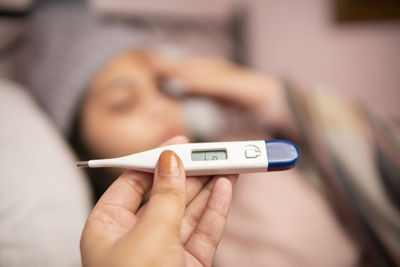 Midsection of woman using mobile phone