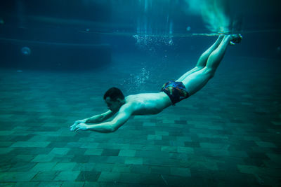 Man swimming in pool