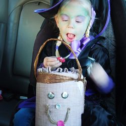 Girl in halloween costume at home