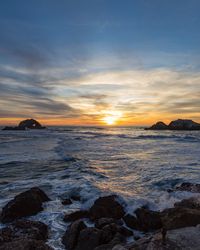 Scenic view of sea against sky during sunset