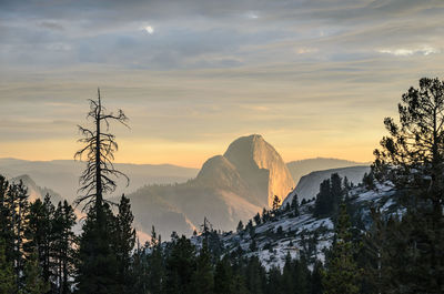 Scenic view of mountains against sky at sunset