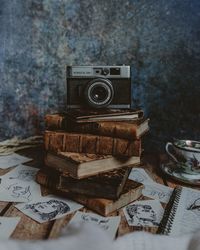 Close-up of old camera on table