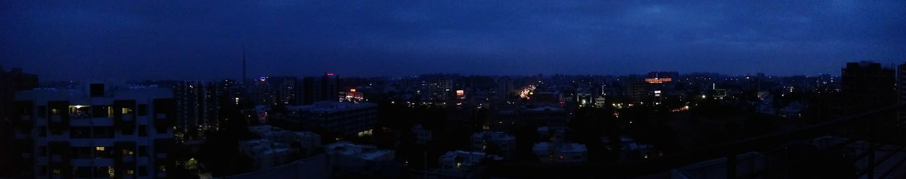 Panoramic view of buildings at night