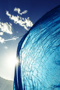 Blue cloth against sunny sky