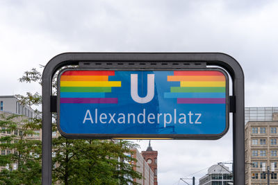 Low angle view of road sign against sky