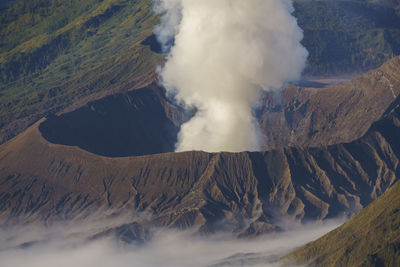 Smoke emitting from volcanic mountain