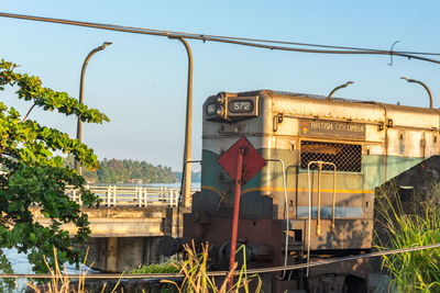 Train on railroad track against sky