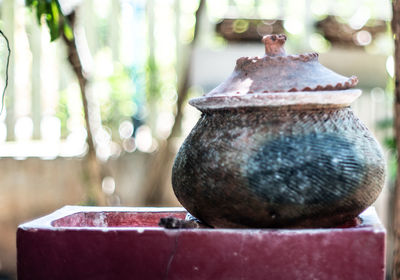 Close-up of old rusty metal on table