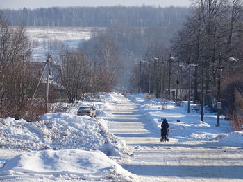 Woman on snow covered land