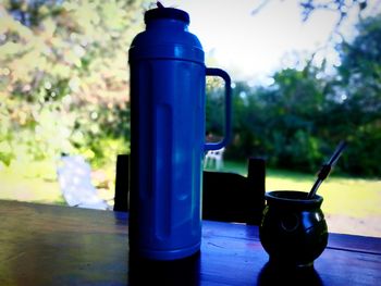 Close-up of blue bottle on table