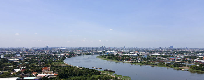 High angle view of river amidst buildings in city