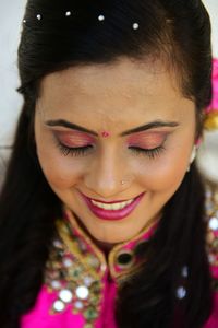 Close-up portrait of a smiling young woman