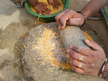 High angle view of woman preparing food in rural areas of india