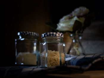 Close-up of glass jar on table