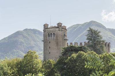 Low angle view of bell tower against sky